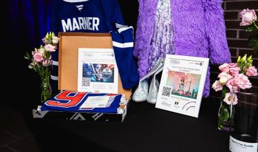Silent auction items displayed on a table