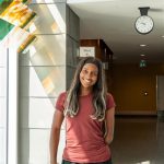 Sheriauna A young woman smiles while standing near an elevator