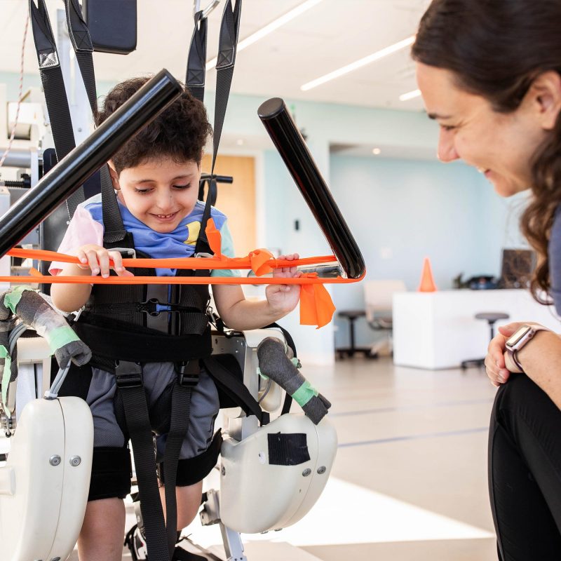 A child walks using an exoskeleton