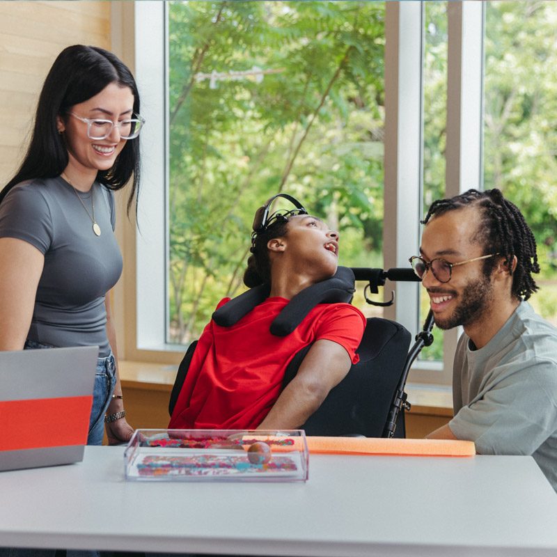 A young person paints using brain-computer interface technology