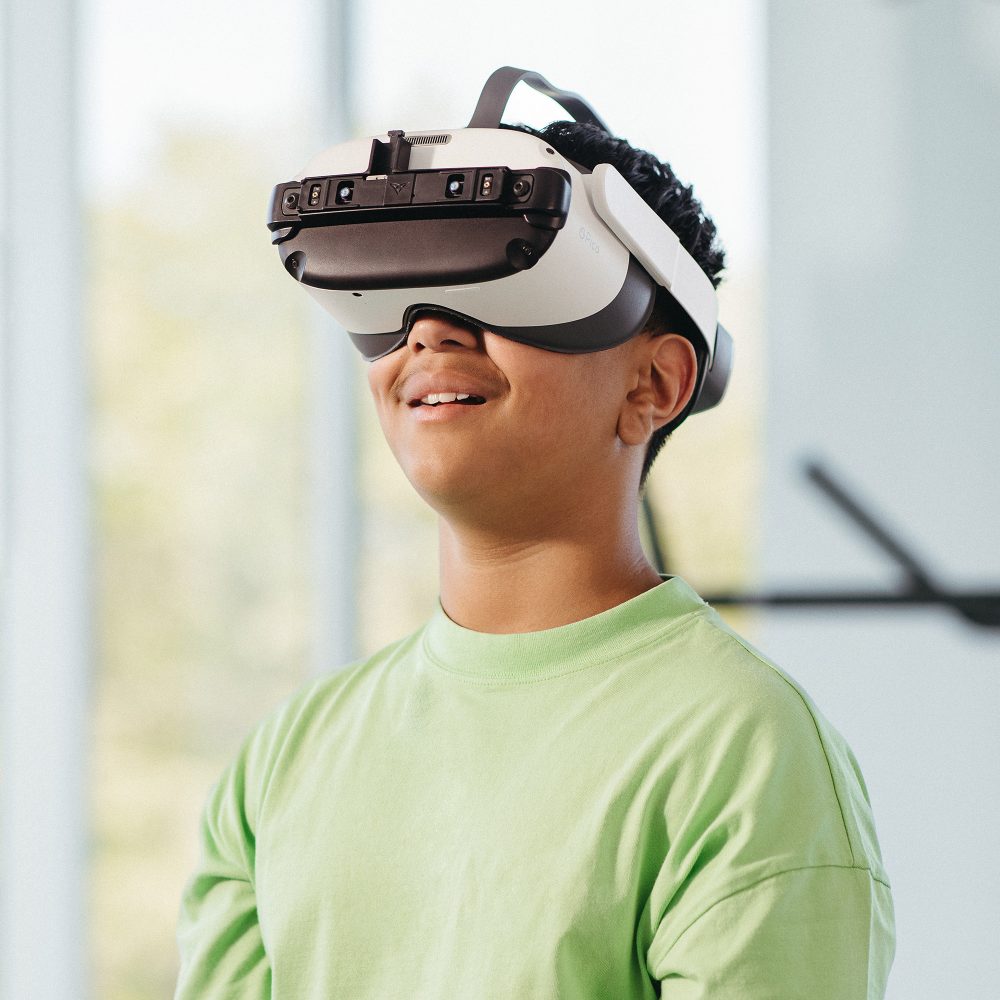 A child wearing a virtual reality headset for therapy