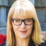 kadey shulz An adult wearing black glasses smiles